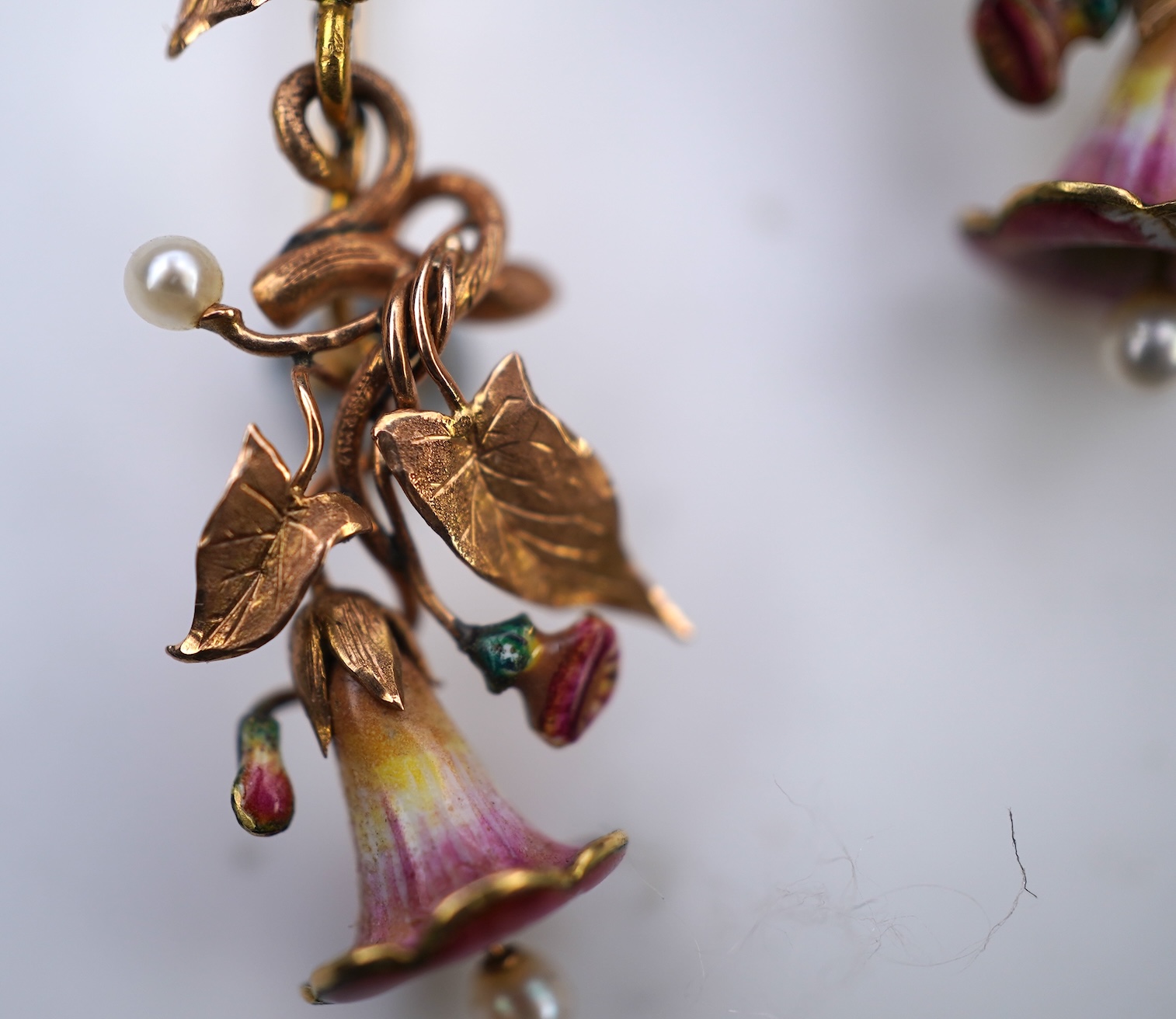 A rare pair of naturalistic gold, enamel and seed pearl earrings, circa 1850